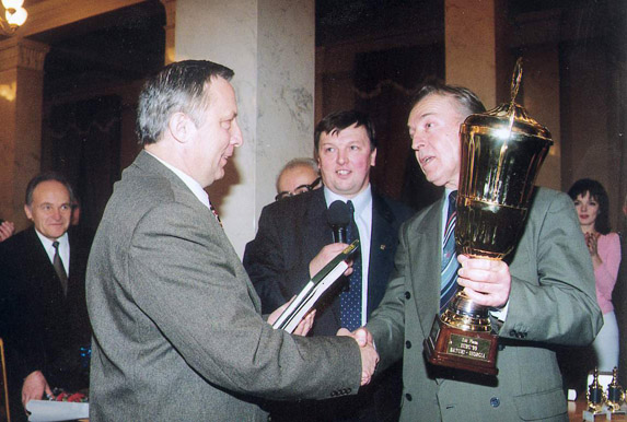Ian Byk, Professor, presents the award to the winner Victor Petrov; the chief organizer and the third prize winner Alexander BARABASH is in the centre